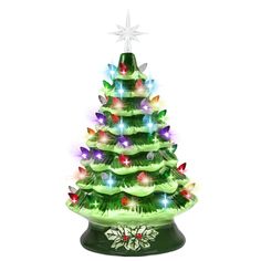 a lighted christmas tree sitting on top of a table