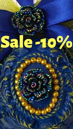 a blue and gold brooch with beads on it is for sale - 100 % off