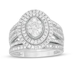 Give her a stunning symbol of your love with this vintage-inspired diamond bridal set. Fashioned in cool 10K white gold, the outstanding engagement ring features an oval-shaped composite of diamonds - the largest a 1/10 ct. stone - wrapped in double frame of diamonds and intricate milgrain. The split multi-row shank shimmers with diamonds and milgrain borders. Seal your vows with the coordinating diamond- and milgrain-lined wedding band. Captivating with 1-1/4 cts. t.w. of diamonds and a bright White Gold Marquise Cut Diamond Bridal Sets, Classic Diamond Bridal Sets Marquise Cut, Classic Marquise Cut Diamond Bridal Sets, Classic Bridal Sets With Halo Setting In Diamond White, Diamond Bridal Sets With Diamond Accents For Marriage, Oval Silver Diamond Wedding Rings, Classic Bridal Sets With Halo Design For Wedding, Classic Wedding Bridal Set With Halo Design, Classic Diamond White Bridal Set With Halo Design