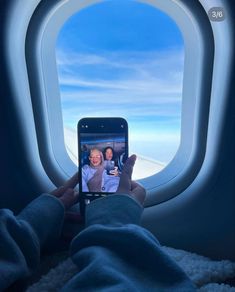 someone is taking a photo of themselves on their cell phone while flying in the sky