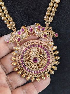 Step into the world of timeless elegance and traditional beauty with this stunning Ruby and gold toned Traditional Indian  Rani Haar necklace set. This long Rani Haar is adorned with intricate Meena Kari work, and it comes with matching earrings for a complete look.  Long Unique Rani Haar Necklace/ Indian Long Necklace / Pakistani Jewelry / Peacock Necklace Mala /Traditional Jewelry/Gold Plated Bridal Necklace PRODUCT VARIATIONS - We strive to present each product with utmost accuracy and detail Temple Jewelry Sets With Latkans And Round Shape, Gold Plated Jewelry With Intricate Design For Puja, Bollywood Style Jewelry With Intricate Design For Puja, Festive Bollywood Jewelry Sets With Peacock Design, Elegant Peacock Design Earrings For Puja, Festive Hand Set Round Temple Necklace, Festive Round Temple Necklace With Hand Set, Festive Round Jewelry For Puja, Traditional Kundan Jewelry With Filigree Details