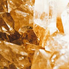 some very pretty yellow and brown crystals in close up view with the focus on them