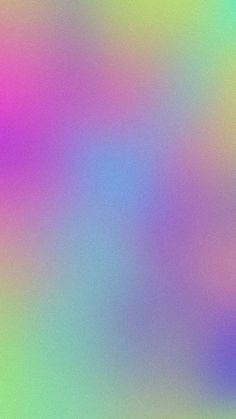 an abstract blurry background in pink, blue and green