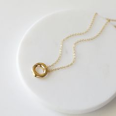 "Beautiful and lovely gold pendant necklace. Made of small gold circle pendant with skinny gold plated brass chain. Soft and warm. Great for gift, everyday or special occasion. Your item will ship in a gift box. Please feel free to contact me if you have any question. ♥ Length 15\" - 20\" ♥ Pendant 5/8\" ♥ Gold plated over brass ♥ See more Rudiana Accessories Rudiana.etsy.com" Gold Circle Minimalist Charm Necklace, Minimalist Circle Charm Gold Necklace, Minimalist Gold Circle Charm Necklace, Everyday Yellow Gold Circle Charm Necklace, Minimalist Yellow Gold Charm Necklace As Gift For Her, Gold Circle Charm Necklace For Gift, Minimalist Round Charm Necklace For Bridesmaid, Simple Gold Charm Necklaces For Bridesmaids, Gold Charm Necklace For Bridesmaid Gift