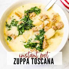 a white bowl filled with pasta and spinach next to a red and white striped napkin