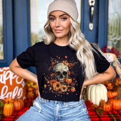 🌻 Welcome Fall with Style! 🌻 Fall T-Shirt, Halloween Shirt Get ready for autumn with this awesome fall t-shirt! Featuring a cool skull and beautiful flowers, this design is perfect for the season. Whether you're hanging out with friends, going to a pumpkin patch, or just chilling at home, this shirt is a must-have. Why You'll Love It: Super Soft and Comfy: Made from high-quality Bella + Canvas shirt, this shirt feels great on your skin. Perfect Fit: Available in different sizes, it's easy to f Casual Skull Print Top For Fall, Casual Skull T-shirt For Fall, Fall Skull Print Short Sleeve T-shirt, Casual Skull Print T-shirt For Halloween, Fall Skull Print Cotton T-shirt, Skull Print Short Sleeve T-shirt For Fall, Fall Cotton T-shirt With Skull Print, Short Sleeve T-shirt With Skull Print For Fall, Spooky Skull Print Fall Top