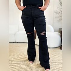 - Brand: Judy Blue - Style: 88622 - Size: Multiple Available - Color/Wash: Black Denim - Material: 69% Cotton, 23% Polyester, 7% Rayon, 1% Spandex - Care: Machine Washable - Rise: High Rise / High Waist - Fit: Flare - Length: Regular - Stretch: Slightly Stretchy - Closure: Single Button And Zipper Fly - Pockets - Distressed / Ripped / Torn - Model Wearing Size: 1 - New With Tags Measurements: 0(24):Hip 29 In, Waist 24 In, Inseam 33 In, Rise 10 In 1(25):Hip 30 In, Waist 25 In, Inseam 33 In, Rise Jean Pants, Pants Plus Size, Denim Material, Judy Blue Jeans, Muffin Top, Black Legs, Blue Style, Denim Flares, Bell Bottom