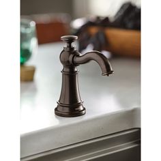 a faucet that is sitting on top of a counter