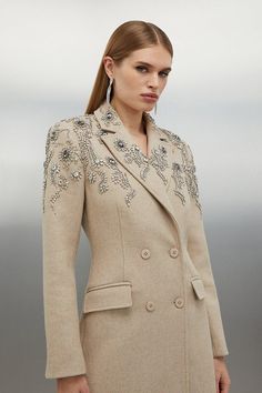 The Evergreen Splendour Of The Wool Coat Is Celebrated In This Collection. Featuring A Plethora Of Luxurious Fabrications, Including Italian Virgin Wool, Boucle, Cashmere, Merino And Tweed, You Can Expect Nothing But The Finest Designs From Karen Millen. A Shrewd Fall-Winter Investment Piece, Browse Our Collection Of Wool Coats And Find The Silhouette Which Piques Your Sartorial Interest, Whether That Is A Classic Double-Breasted Wool Coat, Blazer Or Something More Military-Inspired. With Premiu Chic Embellished Winter Blazer, Evening Wool Coat With Lapel Collar For Winter, Wool Coat For Evening Wear In Fall, Winter Embellished Long Sleeve Blazer, Luxury Embellished Winter Outerwear, Elegant Embellished Fall Outerwear, Tailored Wool Outerwear For Party, Embellished Winter Wedding Outerwear, Winter Wedding Embellished Outerwear