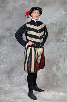 This costume includes doublet and slops (trunkhose).  The doublet is a fitted garment in waist length with shoulder wings and waist skirting. Different form of wings or skirting is possible. The slops are a knee length with optional codpiece. Shorter style  is also possible. The main fabric is woolmix, red and gold are taffetas. I could imagine silk, brocades. Please ask. This is only an example of the costume, I am open for different designs. Bitte senden Sie mir Ihre Maße, nachdem die Bestellu Historical Costumes For Medieval Festivals Costume Party, Fitted Traditional Costumes For Larp, Traditional Fitted Costume For Larp, Historical Costume For Medieval Festivals With Historical Design, Historical Costume For Medieval Festivals, Traditional Fitted Costume For Costume Party, Fitted Historical Costume For Larp, Fitted Historical Design Costumes For Costume Party, Fitted Historical Costumes For Costume Party