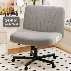 a gray office chair sitting on top of a white rug