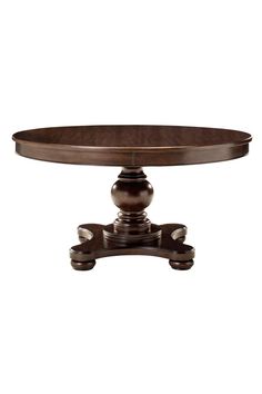 an oval dining table with two leaves on the base and one leaf at the end