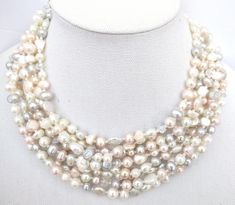 Pearl statement necklace, freshwater pearl and crystal necklace, wedding, bridal,multistrand necklace, cream pearl necklace, cream, white This necklace is one of delicate yet bold beauty. 8 strands of gorgeous light cream freshwater and glass pearls are accented by light pink, peach and light gray freshwater pearls and crystals for a super classy, unique look! It is a great item for gifting, weddings, wearing with a wide array of fashions, and a fabulous addition to any pearl or jewelry lovers' Wedding Multi-strand Pearl Necklace With Pearl Drop, Wedding Multi-strand Pearl Drop Necklace, Multi-strand Pearl White Pearl Necklace For Wedding, Multi-strand Beaded Necklace With Pearl Drop For Wedding, Multi-strand Beaded Necklaces With Pearl Drop For Weddings, Wedding Multi-strand Beaded Necklaces With Pearl Drop, Multi-strand Pearl Drop Beaded Necklaces For Weddings, Multi-strand Pearl Necklace For Wedding, Wedding Multi-strand Beaded Necklace With Pearl Drop