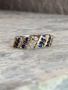 Vintage Sapphire CZ ring Fine jewelry Size 6 Gold plated, pure silver ring Mid century style 12 Simulated sapphire stones each measuring 1 mm round Three CZ stones each measuring 1 mm round Pretty and Dainty 1970 to 1980s ring Handset by experience jeweler Fast and free shipping  Star seller shop White Gold Multi-stone Sapphire Ring, White Gold Multi-stone Sapphire Ring With Round Cut, Formal Multi-stone Cubic Zirconia Birthstone Ring, Fine Jewelry Multi-stone Diamond Promise Ring, Diamond White Multi-stone Sapphire Ring, Anniversary Multi-stone Sapphire Ring, Anniversary Multi-stone Round Cut Sapphire Ring, Anniversary Sapphire Ring With Multi-stone Round Cut, Silver Sapphire Ring With Diamond Accents For Anniversary