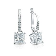 Dangle studs 4-Prong Basket set diamond earrings make a stylish statement in beauty. These 14k white gold diamond earrings sparkle with a 2.00 ct. princess-cut natural diamonds as center stone and 0.10 ct. total weight of small round diamonds as side stone, together with a total weight of 2.10 ct. in lever back clasps. Princess Diamond Earrings, Princess Cut Diamond Earrings, Princess Cut Earrings, Black Diamond Pendant, Beautiful Diamond Earrings, Black Diamond Studs, Halo Diamond Earrings, White Gold Diamond Earrings, Solitaire Diamond Pendant