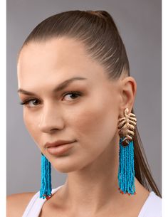 Steven Dann Palm Leaf Beaded Statement Earring in Gold/Ocean. All Sale Merchandise is FINAL SALE. Gold toned textured palm leaf post. Cerulean blue beaded tassels. Orange bead details. Classic post. Approx. 4" long. Turquoise Fringe Beaded Earrings For Beach, Turquoise Tassel Earrings With Colorful Beads For Beach, Blue Tassel Earrings With Dangling Beads For Beach, Turquoise Earrings With Beaded Fringe For Beach, Blue Beaded Fringe Earrings For Beach, Blue Fringe Beaded Earrings For Beach, Rococo Sand, Minnie Rose, Cerulean Blue