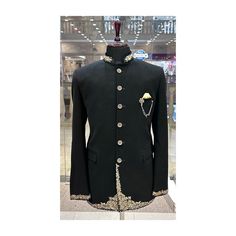 "Make an edgy statement with our BLACK lion  EMBROIDERED INDO WESTERN designed thoughtfully for the modern Indian man. A fusion staple fit for every occasion, adds the right amount of cultural twist to the western silhouette. Color: Black  Garment Type: Indo Western Neck: Mandarin Collar Fabric: Micro Velvet Embroidery: Zari work with sequin embroidery The Product Price is inclusive of: 1 Indo-Western and 1 Trouser Style Bottom Model is 6'2\" wearing Size 38 Product color may slightly vary due to photographic lighting sources or your screen settings. ~We provide fully stitched outfits as per your measurements ~Outfits can be customised in any colours For customisation please contact  ~We provide worldwide shipping ~You choose we design. ~High quality dresses no replicas only hand embroider Festive Black Blazer For Groom, Black Bandhgala For Groom At Festive Occasions, Black Ceremonial Sherwani For Winter, Traditional Black Blazer For Groom, Black Bandhgala For Ceremonial Occasions And Festivals, Black Sherwani For Winter Wedding, Elegant Semi-stitched Black Bandhgala, Black Winter Sherwani For Groom, Black Winter Sherwani For Grooms