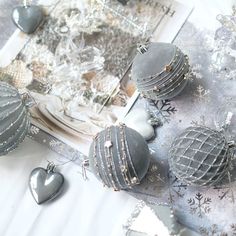 a table topped with lots of silver items and decorating utensils on top of it