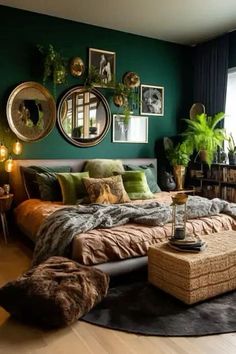 a bedroom decorated in green and brown with pictures on the wall above the bed,