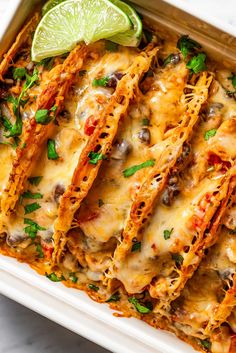 an enchilada casserole with cheese, black beans and cilantro