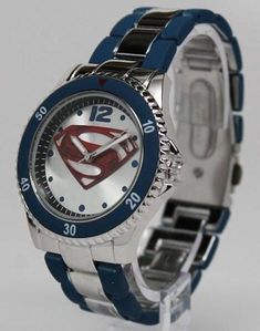 Man of Steel watch that is strong enough to withstand the effects of Kryptonite. This is a young adult / adult sized watch that features the Man of Steel insignia. Uses Japan movement. Stainless steel caseback. The bracelet is stainless steel with a blue matte finish accented on the watch. Perfect for the Superman in your life. Watch case measures 1.7 inches in diameter. Bracelet is 1 inches wide. Watch is shipped with a crown stopper, protective film of the glass/crystal, and a protective film/ Business Watches With Blue Metal Dial, Superman Necklace, Superman Watch, Blue Stainless Steel Watches With Tachymeter, Blue Stainless Steel Chronograph Watch, Watches Logo, Red Watch, Superman Man Of Steel, Limited Edition Watches