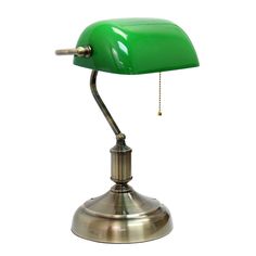 a green desk lamp sitting on top of a metal base