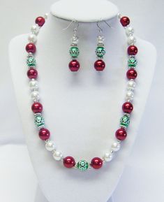 "Holiday Colors- Red/White Glass Pearl w/Green/Silver Bead Necklace/Earrings Set  This necklace set is made with 10mm red and white glass pearls, green with silver acrylic beads and silver plated spacer beads strung on flexible beading wire. It is 19 ½\" in length and fastens with silver lobster clasp. It comes with earrings that hang from silver fish hook ear wires.  Necklace Length: 19 ½\" Earrings Length: 2\" (including ear wires) Closure: Silver Lobster Clasp @325" Kids Bracelets, Silver Bead Necklace, Holiday Colors, Beading Wire, Bead Stringing, Silver Bead, Christmas Jewelry, Acrylic Beads, Necklace Earring Set