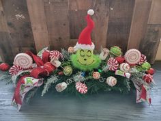 a grin face arrangement with candy canes and candies