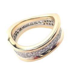 Tiffany & Co 18k Yellow Gold Platinum Diamond Wave Band Ring    Metal: 18k Yellow Gold And Platinum  Ring Size: 5.75  Band Width: 6mm to 8mm  Weight 9.7 grams Stones: 58 Round Brilliant Cut Diamond VS1 clarity, G color,  Total weight Approx 1.4ctw  Hallmarks: Tiffany&Co 750 Plat  Dimensions reference the ring size and are not specific to the ring itself. Luxury Yellow Gold Eternity Band Channel Set, Luxury Yellow Gold Rings With Channel Set, Luxury Yellow Gold Channel Set Rings, Elegant Wide Band Ring With Channel Set, Elegant Wide Band Channel Set Ring, Yellow Gold Channel Set Round Cut Ring, Yellow Gold Jewelry With Channel Set Wide Band, Yellow Gold Wide Band Jewelry With Channel Set, Gold Wide Band Ring With Channel Set