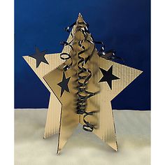 a wooden star with black and white stars on it