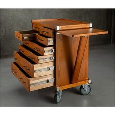 a wooden cart with drawers on wheels