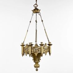 an antique chandelier hanging from a chain on a white background with clippings