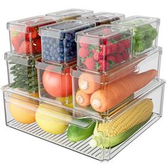 four clear containers filled with different types of fruits and vegetables in each container are stacked on top of each other