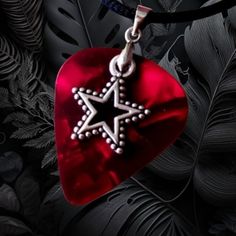 a red heart with a silver star on it