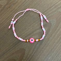 Beautiful Pink Evil Eye Bracelet Never Worn. Pink Resizable Bracelets For Summer, Pink Adjustable Bracelet For Festivals, Adjustable Pink Bracelet For Festival, Adjustable Pink Evil Eye Bracelet, Handmade Casual Evil Eye Bracelet, Adjustable Pink Beaded Evil Eye Bracelet, Pink Adjustable Bracelets For Beach, Casual Pink Bracelets With Adjustable Length, Casual Pink Bracelet With Adjustable Length