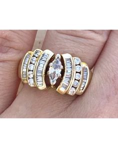 7.9 grams 0.30ct center marquise diamond 0.80ctw diamond accents Size 6.75 SI1 - I1 G - H color Cubic Zirconia Marquise-cut Multi-stone Diamond Ring, Marquise Cut Multi-stone Cubic Zirconia Diamond Ring, Multi-stone Cubic Zirconia Marquise Cut Ring, Marquise Multi-stone Diamond Ring, Marquise Cut Multi-stone Diamond Ring For Anniversary, Classic Diamond Ring With Multi-stone Marquise Cut, Classic Multi-stone Marquise Cut Diamond Ring, Classic Marquise Cut Multi-stone Diamond Ring, Anniversary Marquise Cut Multi-stone Cluster Ring