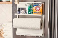 a bathroom shelf with toilet paper and cleaning products on it