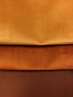 three different colored sheets stacked on top of each other