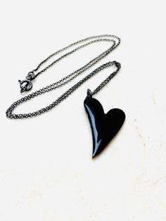 Heart Necklace ~ Black Enamel Minimalist Goth Heart Pendant Necklace Black enamel fused to copper heart. The heart measures 1 inch in height. Includes 18 inch patinated Sterling silver Italian chain. Perfect for The one you love. Handle as glass. Handmade in the Pacific Northwest. 🖤 Minimalist Black Heart Charm Necklace, Minimalist Black Heart Necklace, Minimalist Black Heart Necklace For Valentine's Day, Black Heart-shaped Jewelry, Handmade Black Heart-shaped Jewelry, Nickel-free Black Heart-shaped Jewelry, Nickel-free Black Heart Jewelry, Black Open Heart Necklace For Valentine's Day, Black Double Heart Charm Necklace