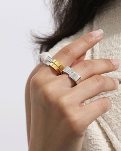 Easily incorporate this Avante-Garde ring into your life and make a statement in style, unusual, and oh-so-interesting. The two-tone finish and crystals enhance the geometric silhouette of this asymmetric square stackable ring. Take your stacked ring collection to the next level.

Band Width: 5.5mm
Stone Color: Bright White
Band Thickness: 1.8mm
Material: Crystals,18k Gold & Rhodium Plated Modern Silver Rings With Plating, Modern Cubic Zirconia Diamond Ring, Elegant Gold Diamond Ring, Modern Diamond Crystal Ring, Modern Open Crystal Ring For Anniversary, Modern Crystal Open Ring For Anniversary, Modern Diamond White Crystal Ring, Modern Gold Crystal Ring With Cubic Zirconia, Modern Cubic Zirconia Crystal Ring