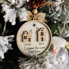 a wooden ornament with two houses on it that says, i worked you lived next door