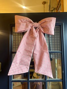 The bow is trending big in decor and design. Use this fabric gingham bow in a variety of ways: add to a wreath, door, knob, chair back, crib, headboard, railing, wedding and seasonal decor. 100% cotton Bow is 18” wide, and 23” long Barlow And Barlow, Front Door Christmas Bows, Quilted Wreath, Crib Headboard, Front Door Bow, Bow Garland, Door Bow, Southern Christmas, Bow Wreath