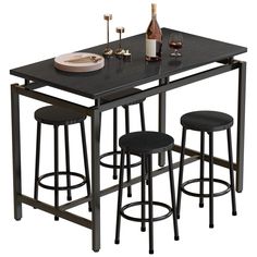 three stools and a table with wine bottles on it are sitting next to each other