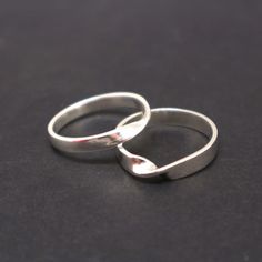 "Sterling Silver Mobius Ring. It's a great alternative for wedding ring. Base Material: 925 Sterling Silver Men Ring Depth: 4mm Women Ring Depth: 2.5mm Metal Stamped: 925 Thickness: 1.5mm Crafting Time: 7 - 10 working days (Non-Peak Season. We try to make it earlier) Shipping Time: 7 - 10 Days (Please top up for Express if you need it urgent) Engraving: Yes. (Please contact us for additional cost.) Plating: Yes. Available in Gold or Rose Gold (Please contact us for additional cost.) Packaging: O Modern Twist Bypass Ring For Wedding, Silver Infinity Ring For Wedding, Silver Infinity Stackable Rings For Wedding, Modern Open Band Bypass Ring For Weddings, Modern Twist Open Band Bypass Ring For Wedding, Modern Sterling Silver Couple Rings For Wedding, Modern Twist Infinity Stackable Rings For Anniversary, Modern Sterling Silver Bypass Ring For Wedding, Modern Sterling Silver Bypass Wedding Ring