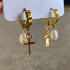 "Dainty Jesus and 8 mm Pearl Earrings This design earrings are made of freshwater pearl and 18K gold filled cross. Pearl is used in our earrings, especially because of the luster. This luster fits perfectly with both your daily outfits and special occasions.   Forget the old saying, \"Pearls bring tears.\" Given pearl symbolism of wisdom, enlightenment, innocence, serenity, protection, and longevity, it's safe to say that pearls are associated with good luck. ☆ If you are a pearl lover, you will Gold Huggie Earrings With Pearl Charm For Gift, Gold Huggie Earrings With Pearl Charm As Gift, Pearl Cross Earrings, Gold Huggie Pearl Earrings For Gift, Gold Huggie Pearl Earrings As Gift, Gold Huggie Pearl Earrings With Ear Wire, Pearl Symbolism, Preppy Jewelry, Jewelry Accessories Ideas