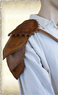 Shoulder guard, pauldron, spaulder. Leather Pauldron, Shoulder Guard, Toy Robot, Larp Armor, Veg Tan Leather, Leather Necklace, Hand Designs, Adult Costumes, Vegetable Tanned Leather