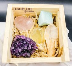 a box filled with lots of different types of rocks and stones on top of each other