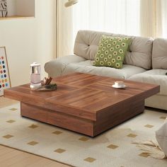 a living room with a white couch and coffee table