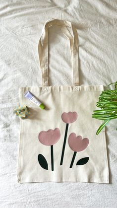 This is a super cute tote bag. This tote is super lightweight and made out of canvas! It is the perfect gift for any occasion. The tote bag is 16" by 15". The handle is 13" long. Cute Tote Bags Paint, Canvas Tote Painting Ideas, Lukisan Tote Bag, Cute Tote Bag Painting Ideas, Totebag Painting Ideas Aesthetic, Painted Tote Bags Ideas, Tote Bag Design Paint, Tote Bag Diy Design, Tote Bag Inspo Paint