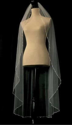 a mannequin with a veil on top of it